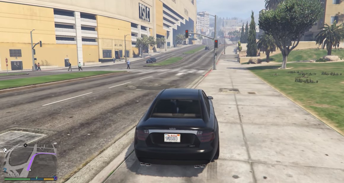 A car driving on the road following a highlighted route shown in map at bottom left in GTA 5