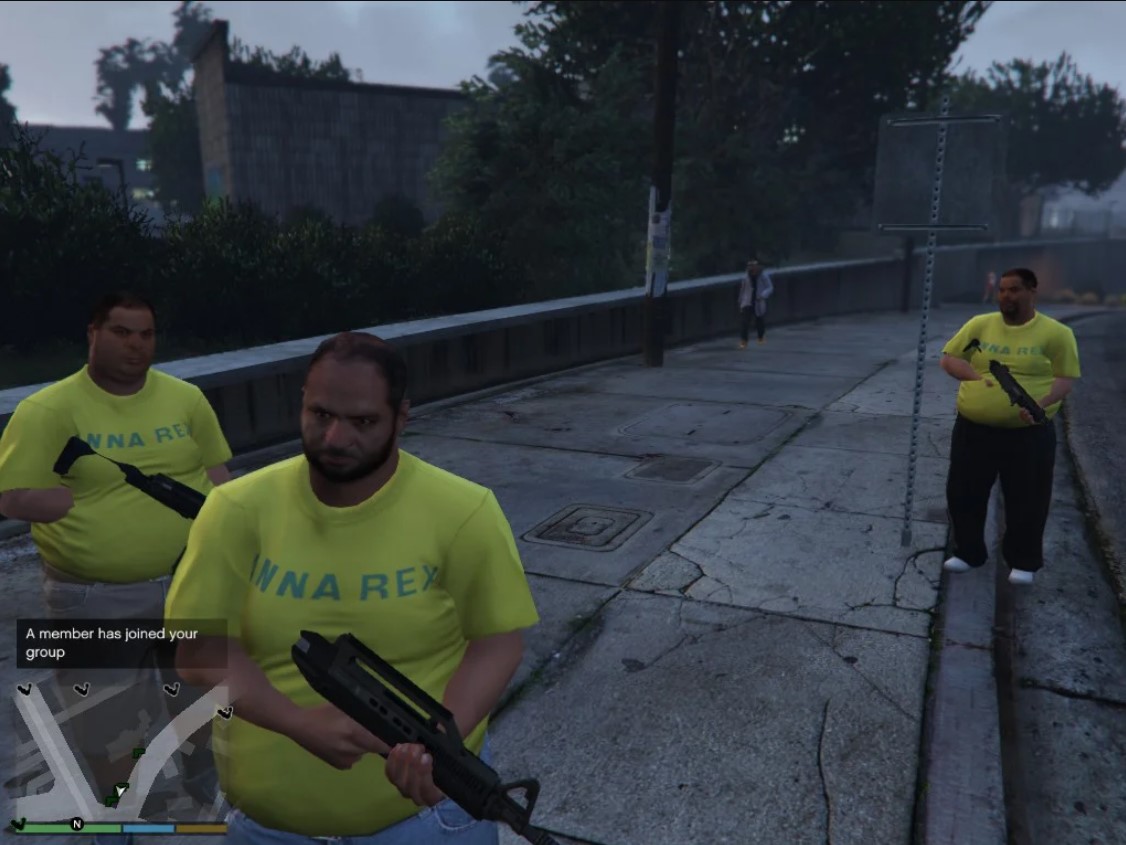 3 fat guys with guns wearing the same shirt. Indicating they part of a gang