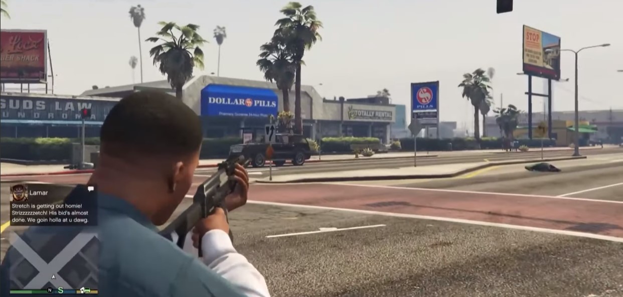 Franklin shooting a gun on the streets.