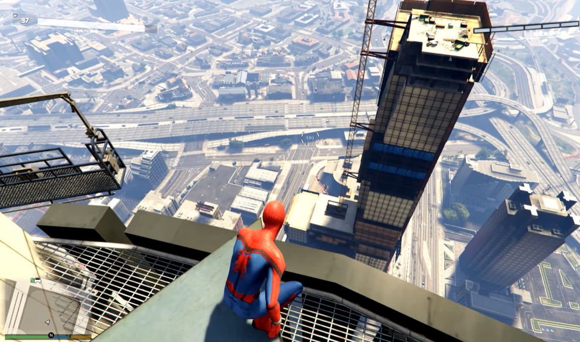 Spiderman standing on a tall building looking down at the view