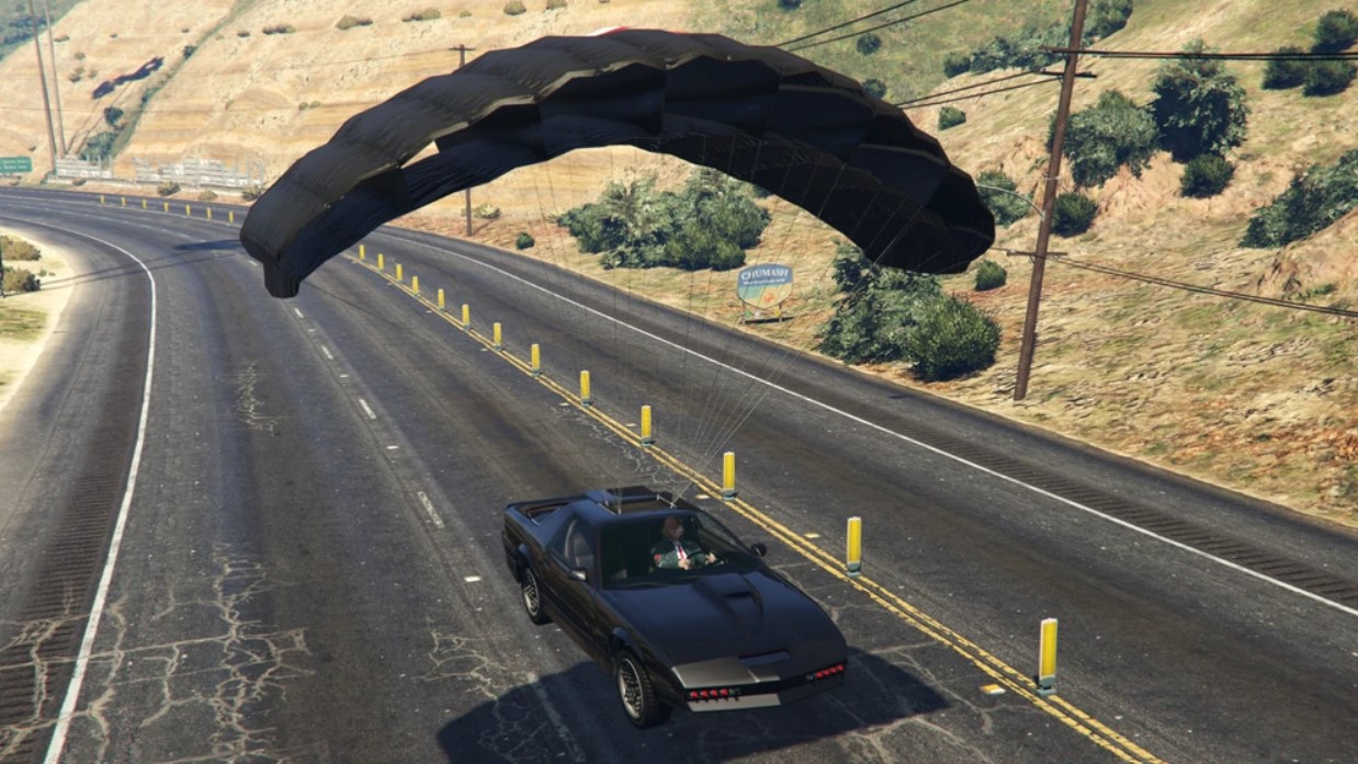 Ruiner 2000 with parachute in GTA 5, landing on highway.