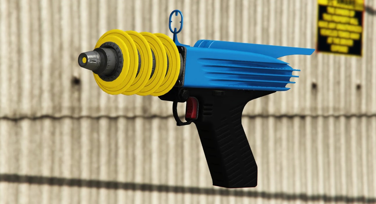 Up-n-atomizer is a gun with a yellow tip and a blue and black body.