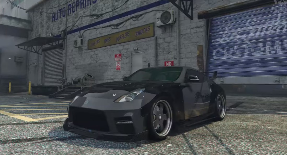 D.K's car being build in GTA 5. a black car outside a garage.